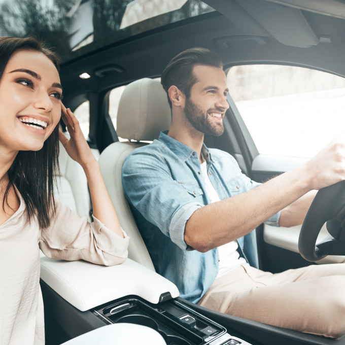 Couple driving in car