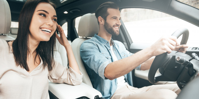 Couple driving in car