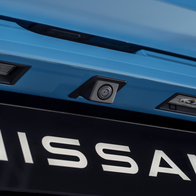 detailed Nissan name plate under the rear around view camera