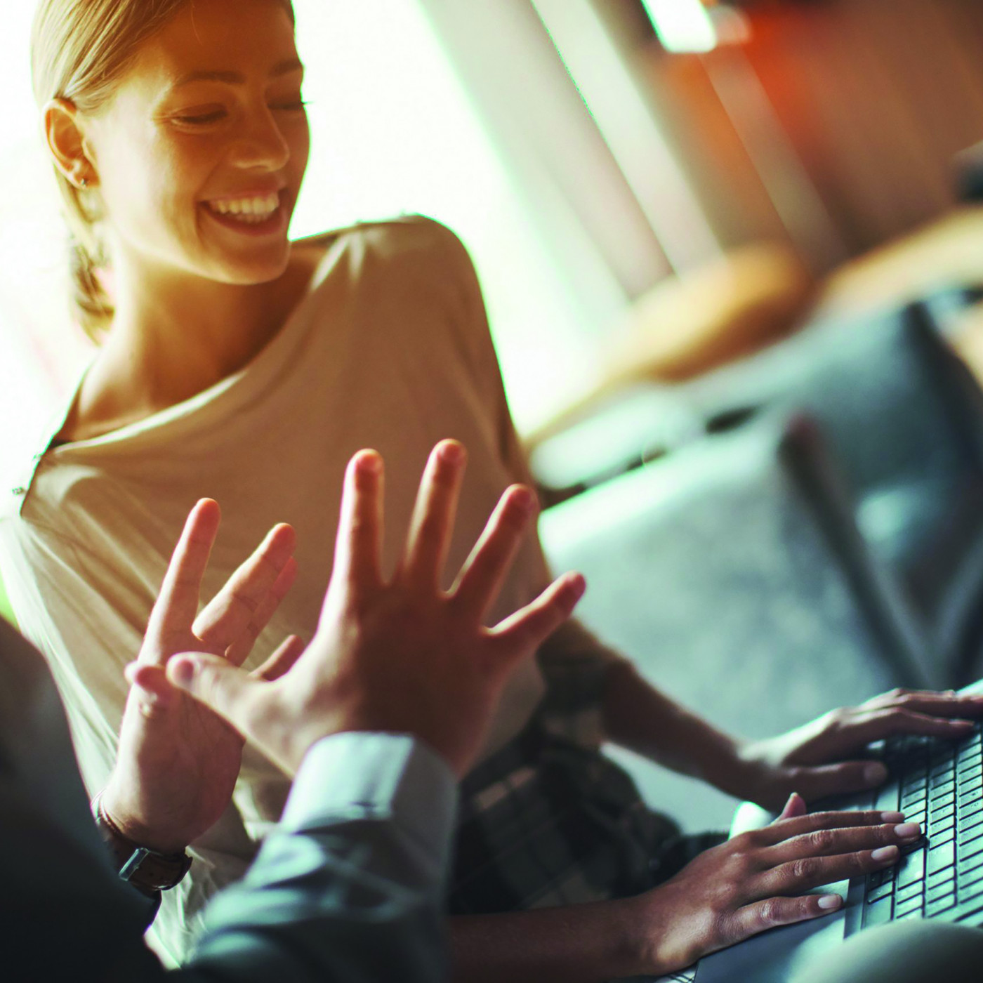 Man and woman behind computer