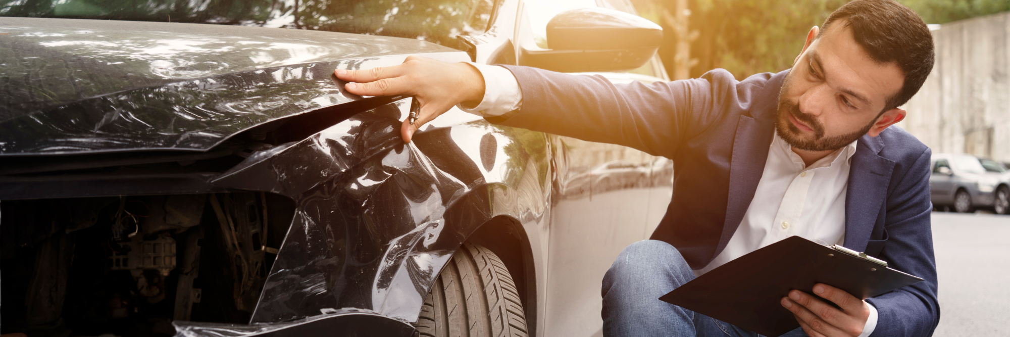 PNG Man examining car crash 1