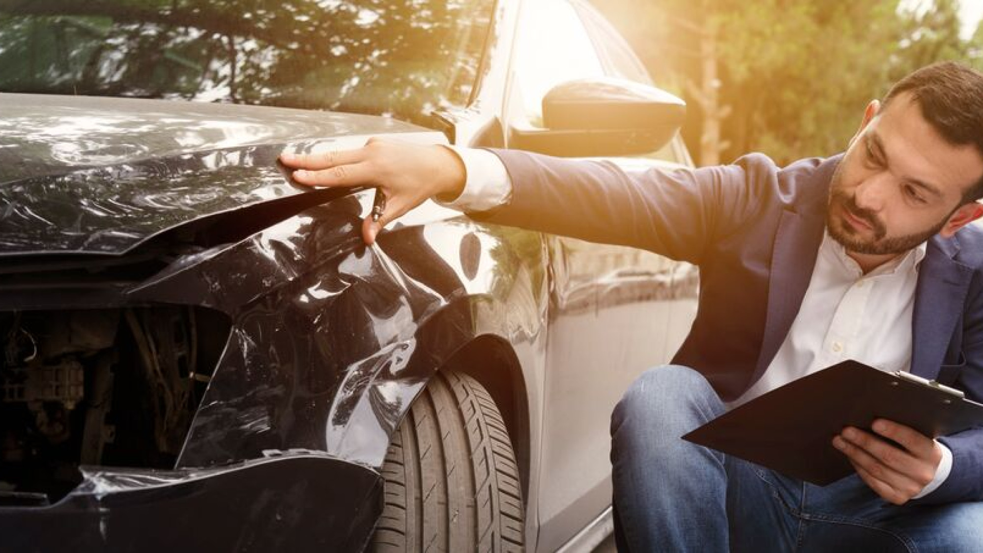 Medium Man examining car crash 2