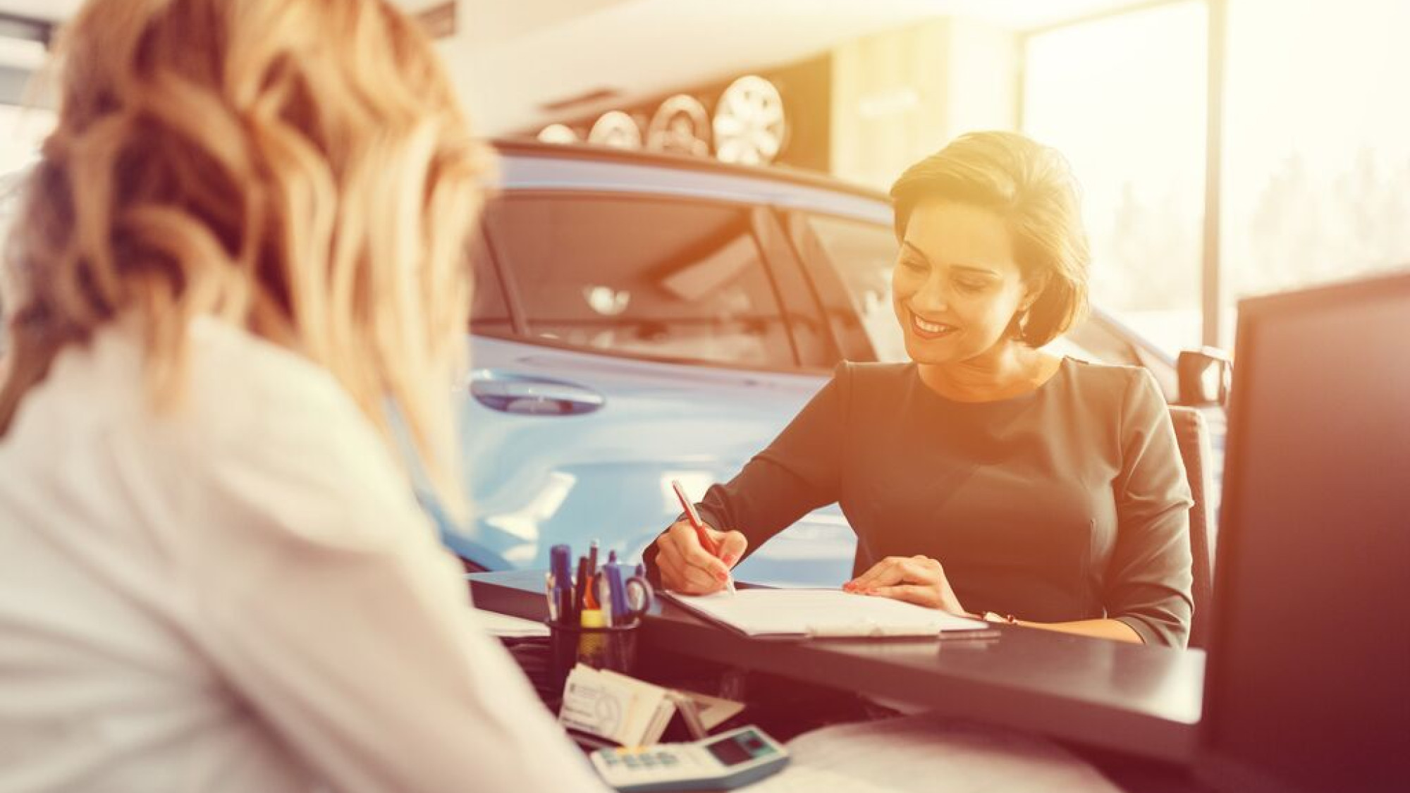 Medium Women in car dealership