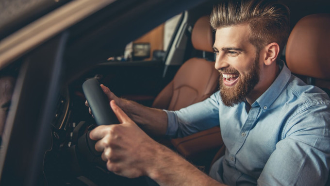 Large Excited man in car