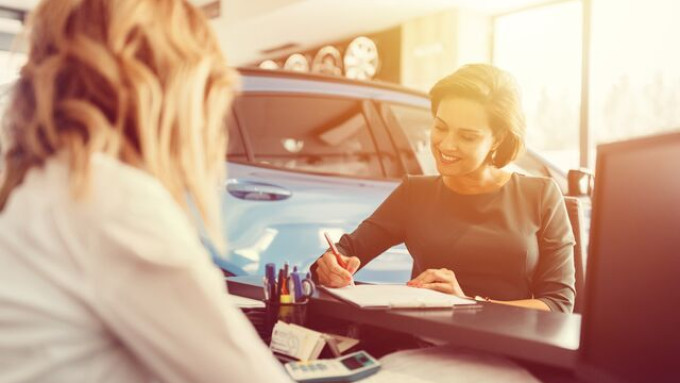 Small Women in car dealership 1