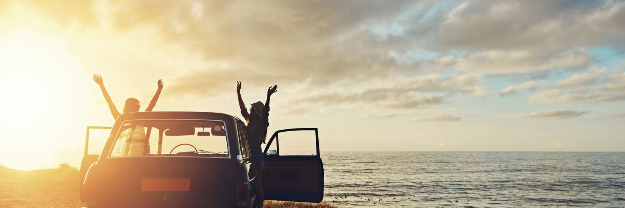 Large People and car on beach