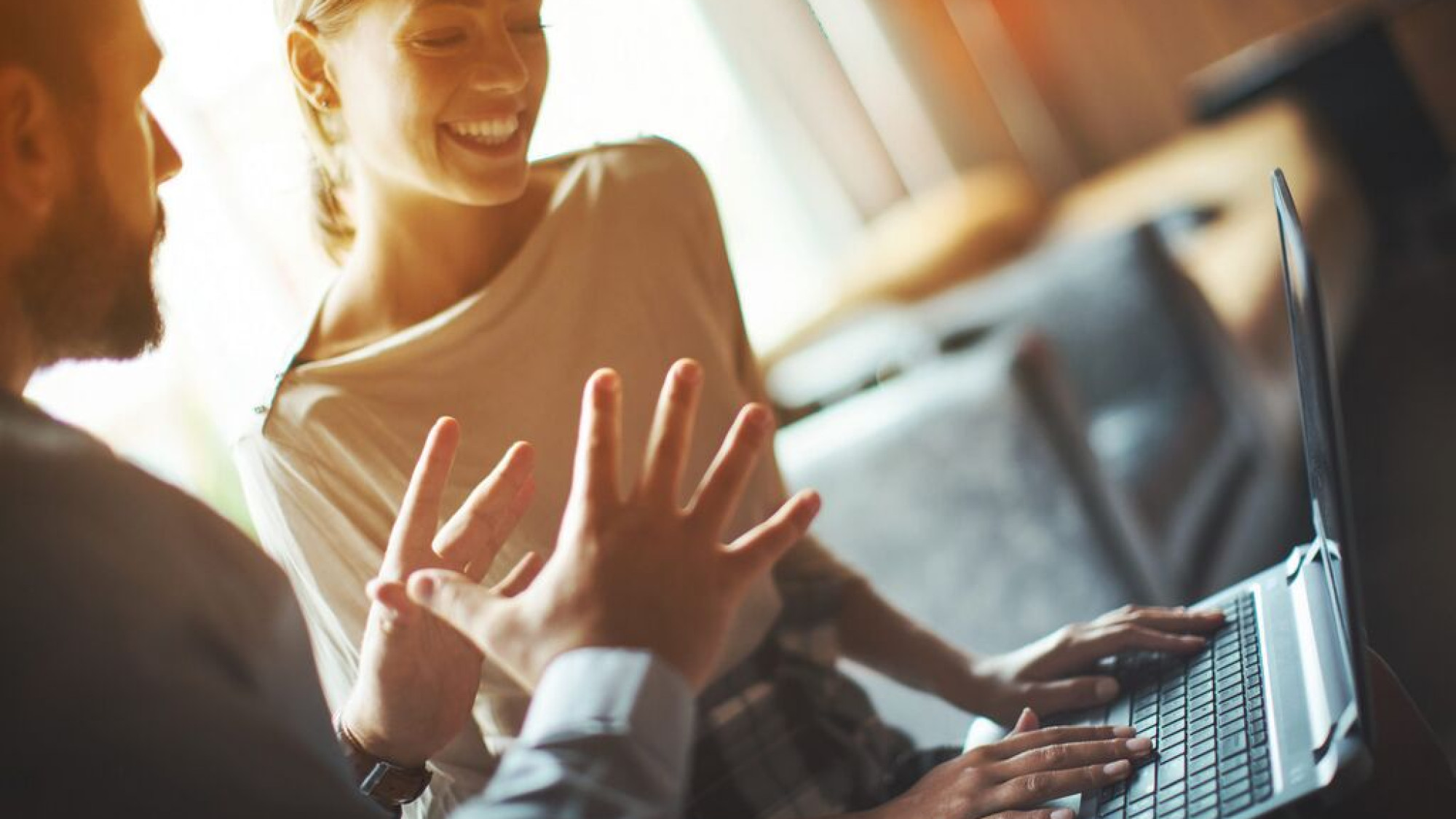 Medium Man and woman behind computer